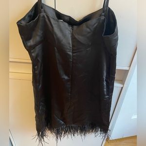 Black silk dress with feathered bottom